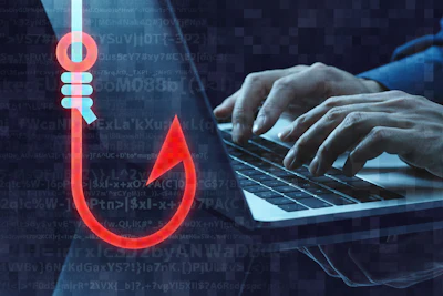 Cybersecurity concept showing hands typing on laptop with digital phishing hook