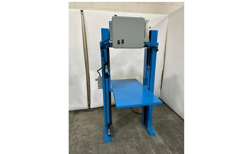 Blue industrial lifting platform with vertical support columns and control box