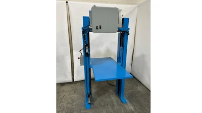 Blue industrial lifting platform with vertical support columns and control box