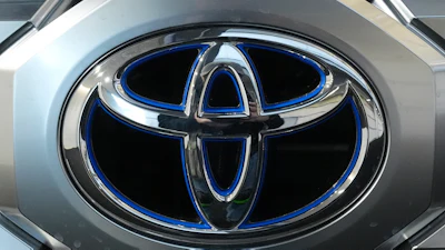 Toyota metallic blue and silver corporate logo emblem