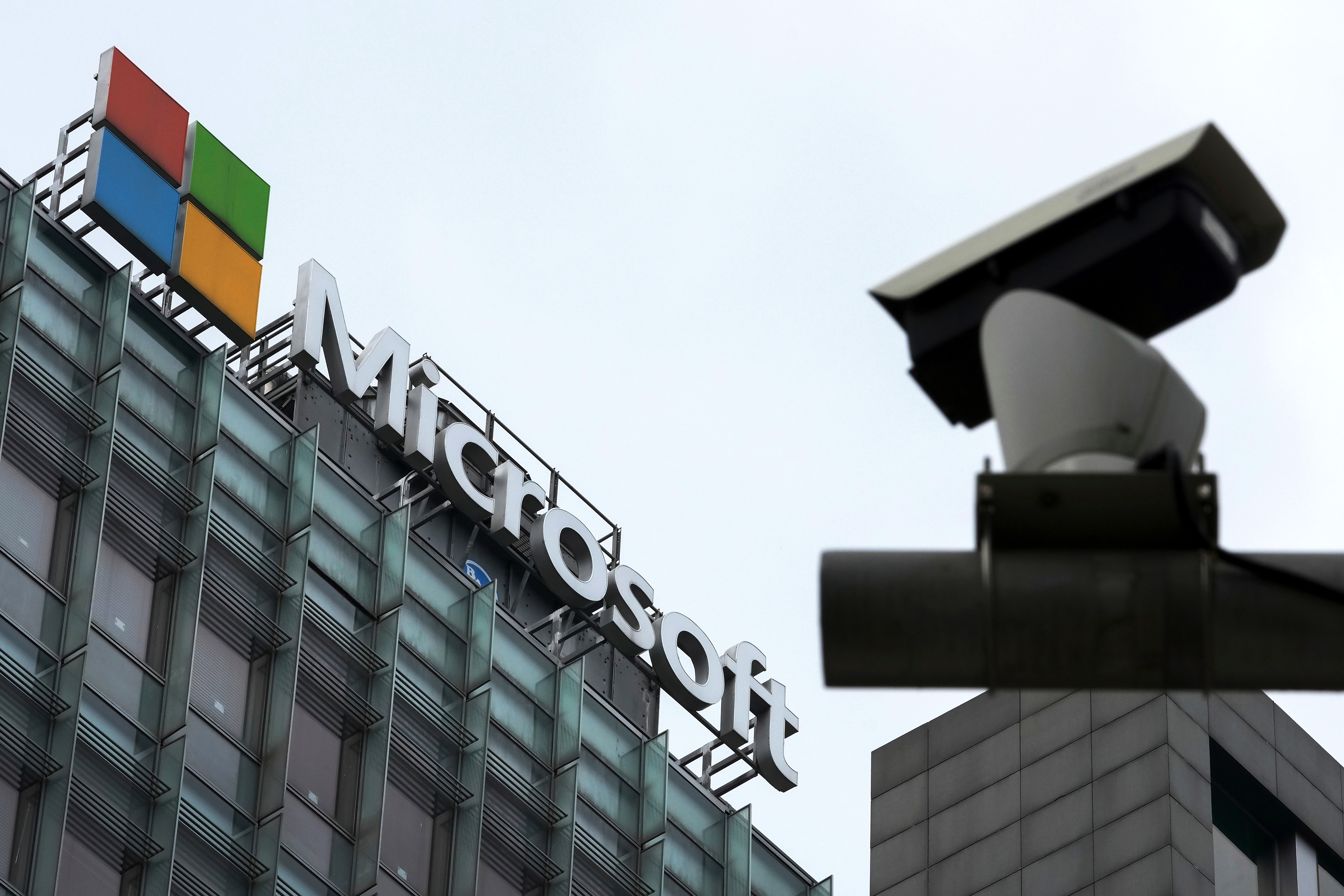 Microsoft headquarters building with corporate logo and security camera