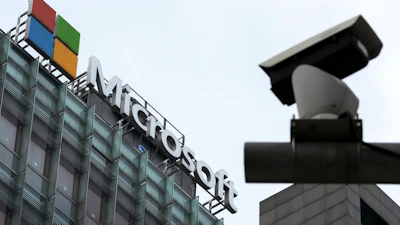 Microsoft headquarters building with corporate logo and security camera