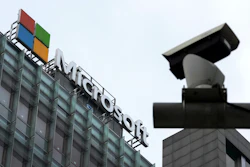 Microsoft headquarters building with corporate logo and security camera