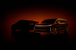 Two sleek electric SUVs silhouetted against a dramatic red-orange background