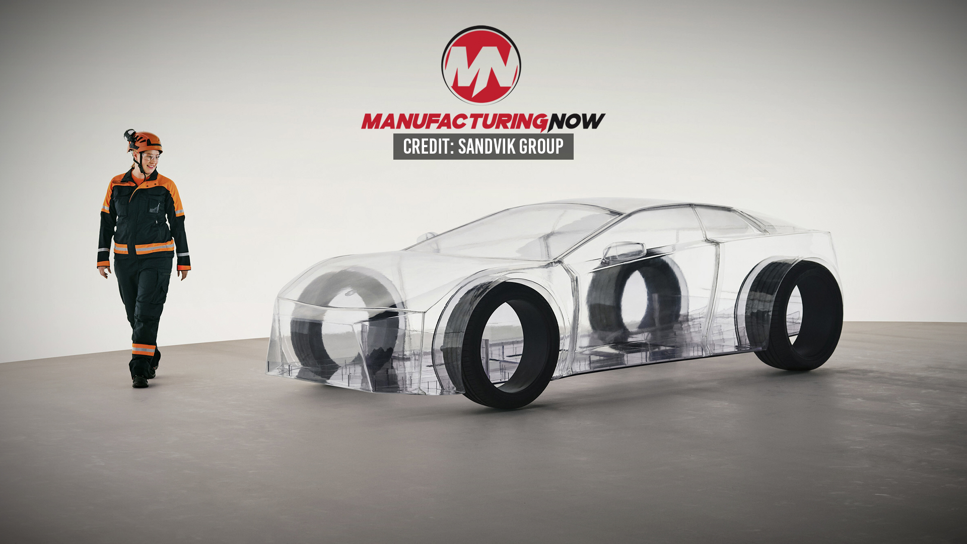 Manufacturing Now logo with transparent car prototype and worker in safety gear