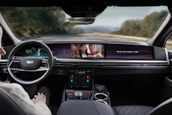 Cadillac Escalade interior dashboard while driving on scenic mountain road