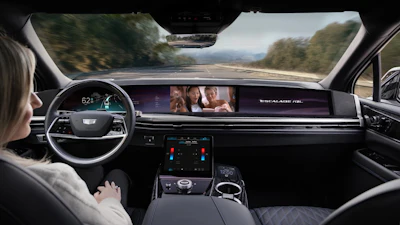 Cadillac Escalade interior dashboard while driving on scenic mountain road