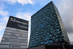 Modern blue-gray office building with corporate sign at 52 Nijmegen complex