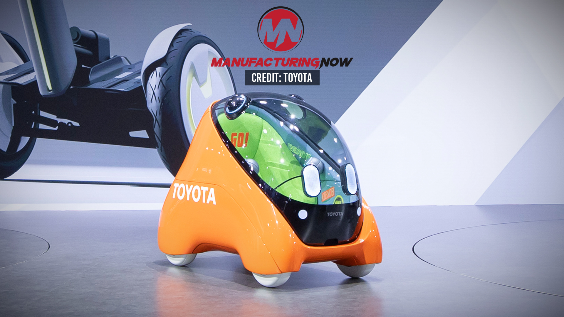 Futuristic orange Toyota concept vehicle with transparent green bubble canopy
