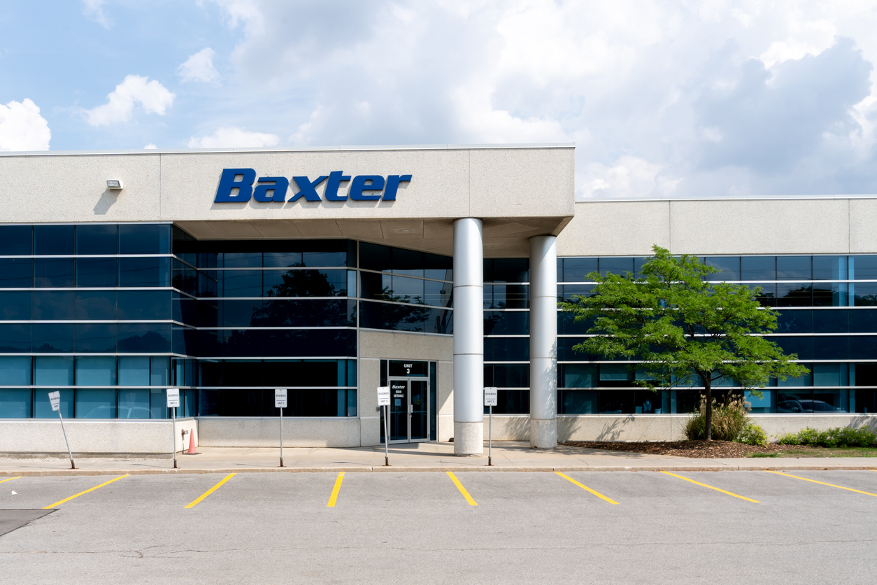 Baxter corporate headquarters building with blue glass exterior and white columns
