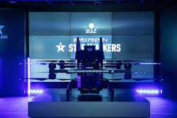 High-tech drone on illuminated display with blue and purple lighting