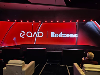 Qand Redzone corporate stage backdrop with red lighting