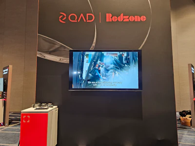 QOAD and Redzone corporate display booth with digital screen