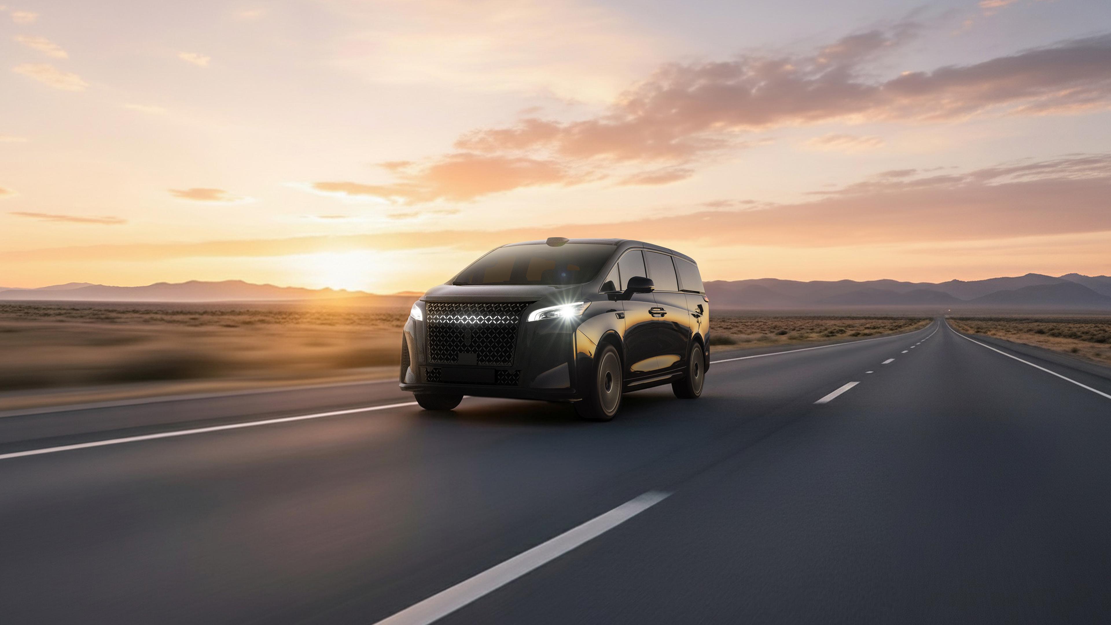 Black SUV driving on desert highway at sunset with mountains in background