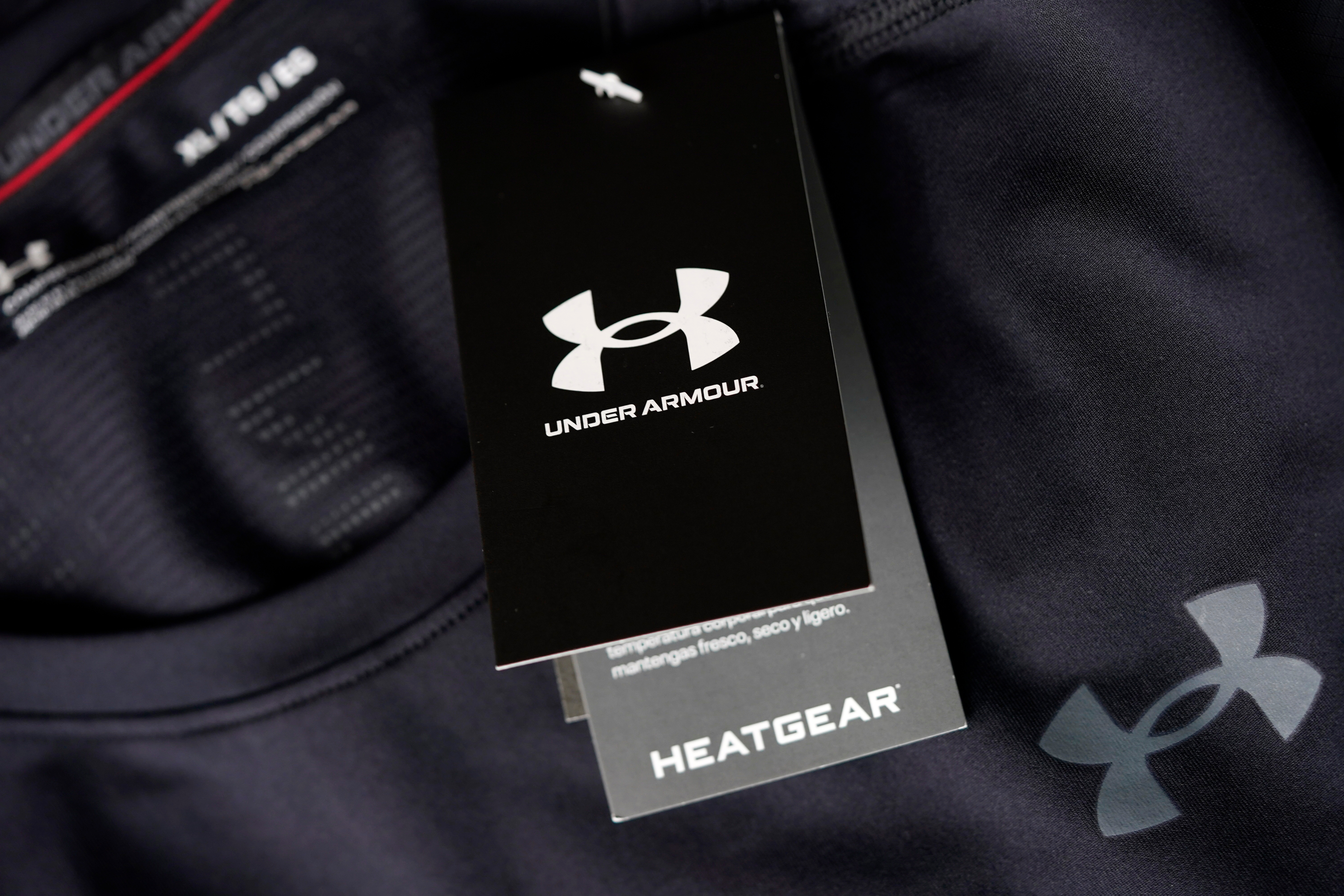 Under Armour Heatgear clothing tag with white logo on black background