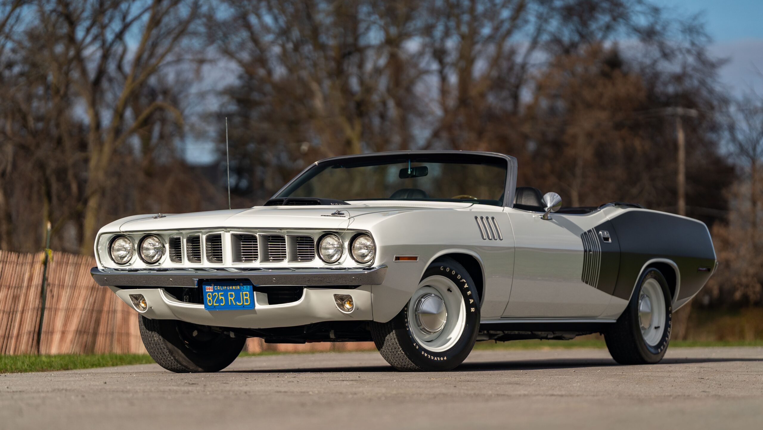 Classic white 1971 Plymouth Barracuda convertible parked outdoors