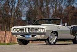 Classic white 1971 Plymouth Barracuda convertible parked outdoors