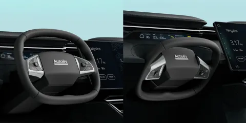 Car dashboard with digital steering wheel and Autoliv interface display