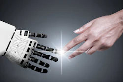 Robotic hand and human hand reaching toward each other with glowing connection point