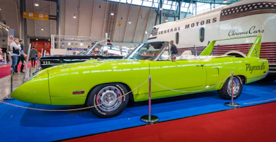 Bright green Plymouth Superbird classic muscle car on display at automotive show