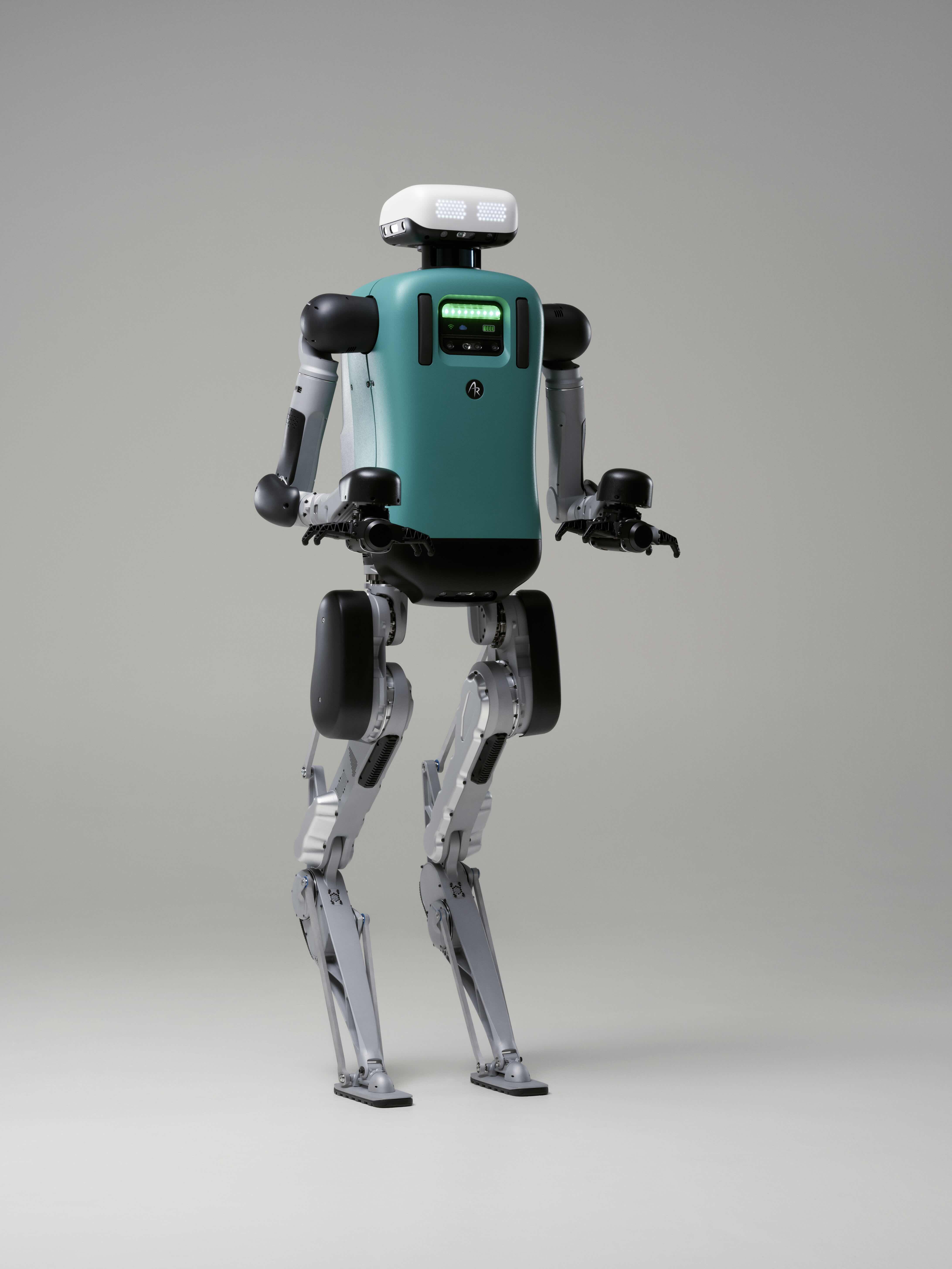 Teal and silver humanoid robot standing upright with articulated limbs