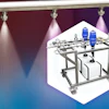 Industrial mobile cart with metal frame, white storage containers, and blue chemical bottles under stage lighting