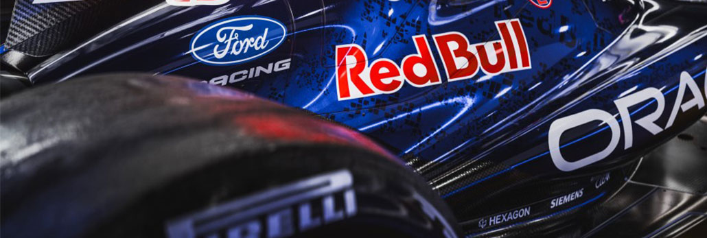 Racing vehicle with Ford Racing and Red Bull logos on dark metallic surface
