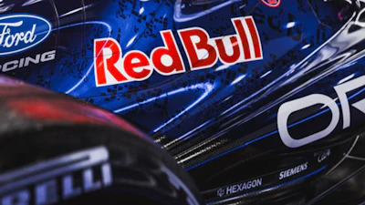 Racing vehicle with Ford Racing and Red Bull logos on dark metallic surface