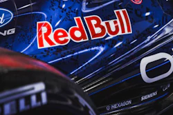 Racing vehicle with Ford Racing and Red Bull logos on dark metallic surface