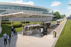 Modern transit station with buses, shelter, and accessible entrance near glass building