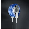 Blue circular battery or electronic component with white terminals