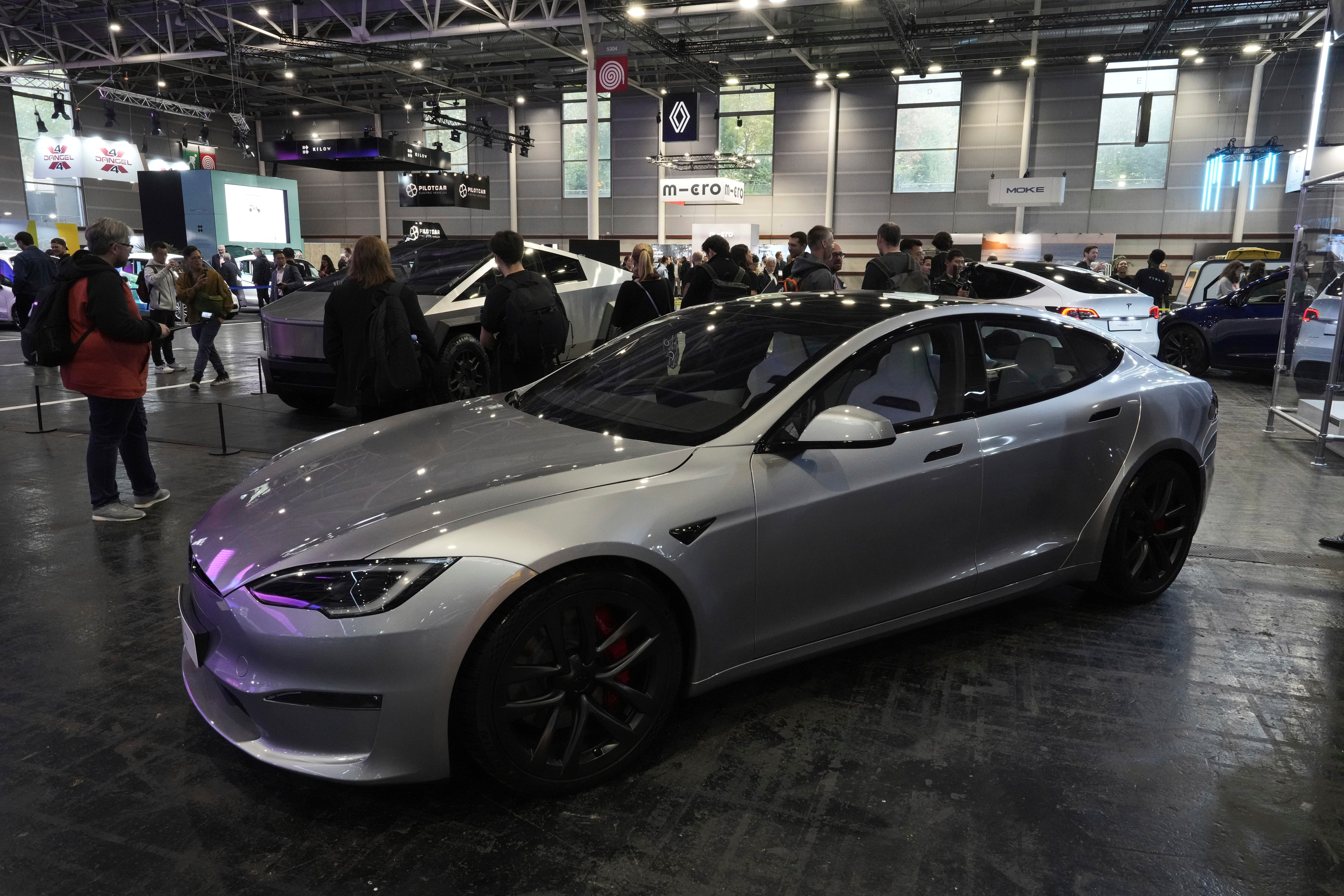 Silver Tesla Model S electric car on display at automotive conference