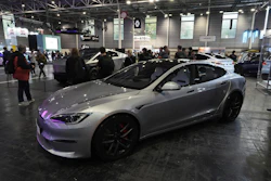 Silver Tesla Model S electric car on display at automotive conference