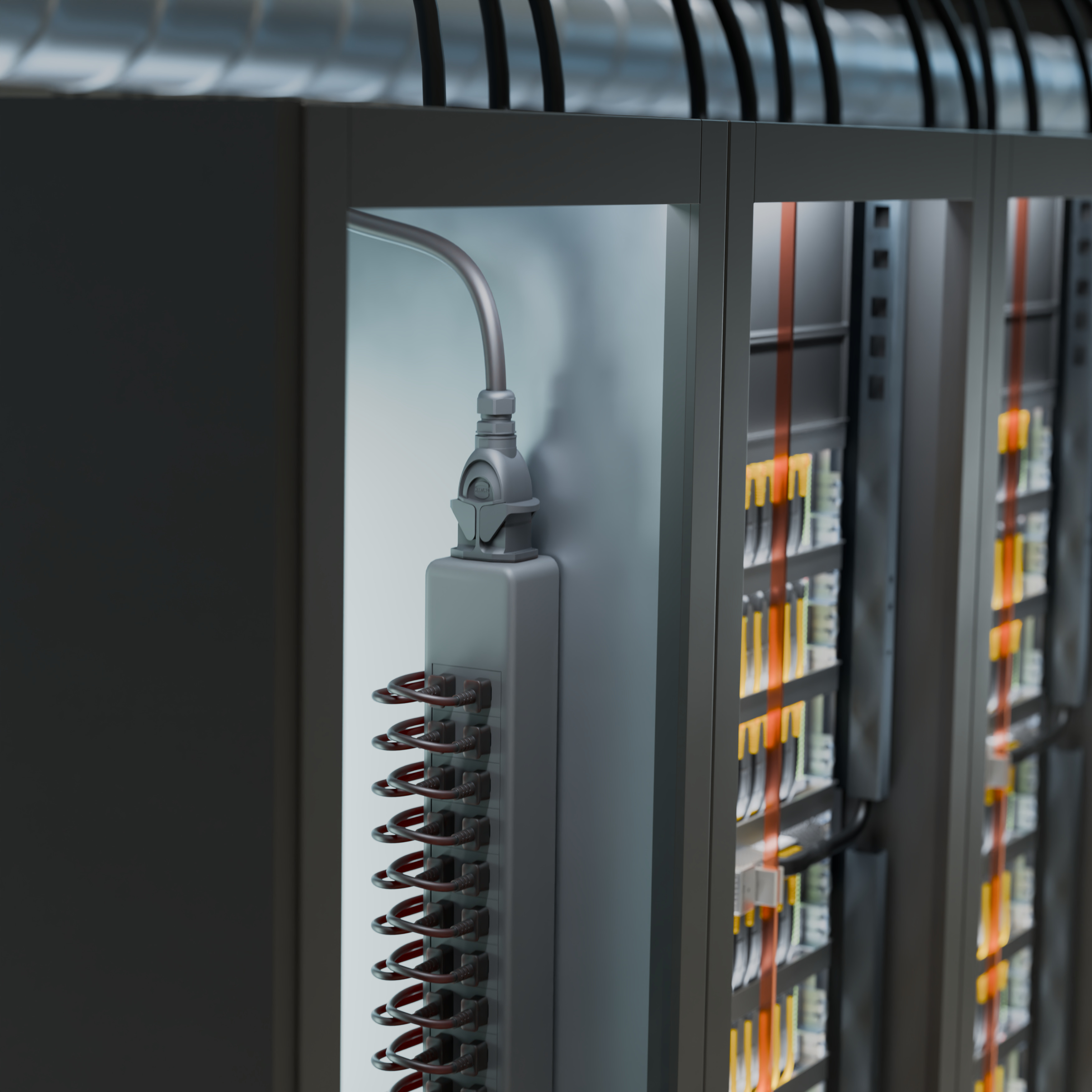 Power strip with coiled cable mounted inside industrial electrical panel with organized wiring