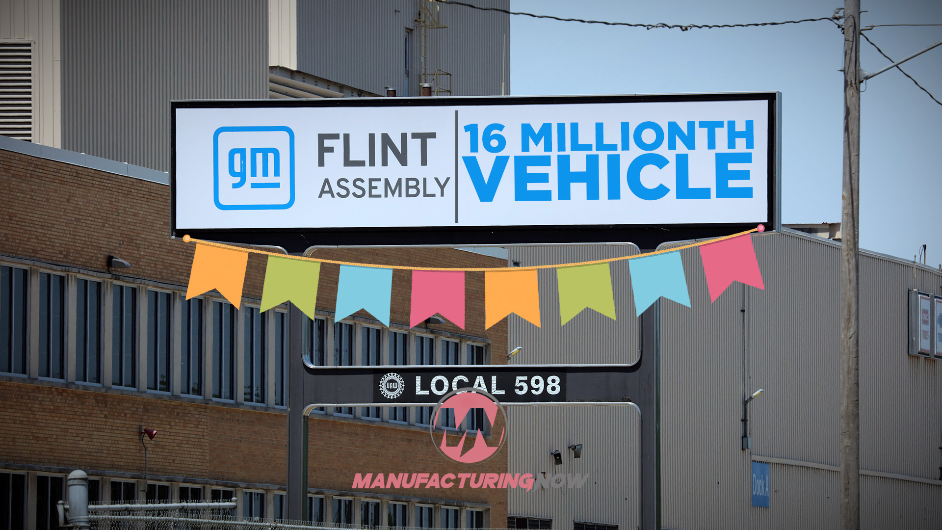 GM Flint Assembly celebrates 16 millionth vehicle milestone with colorful bunting and Local 598 signage on industrial building