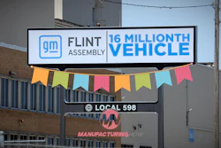 GM Flint Assembly celebrates 16 millionth vehicle milestone with colorful bunting and Local 598 signage on industrial building