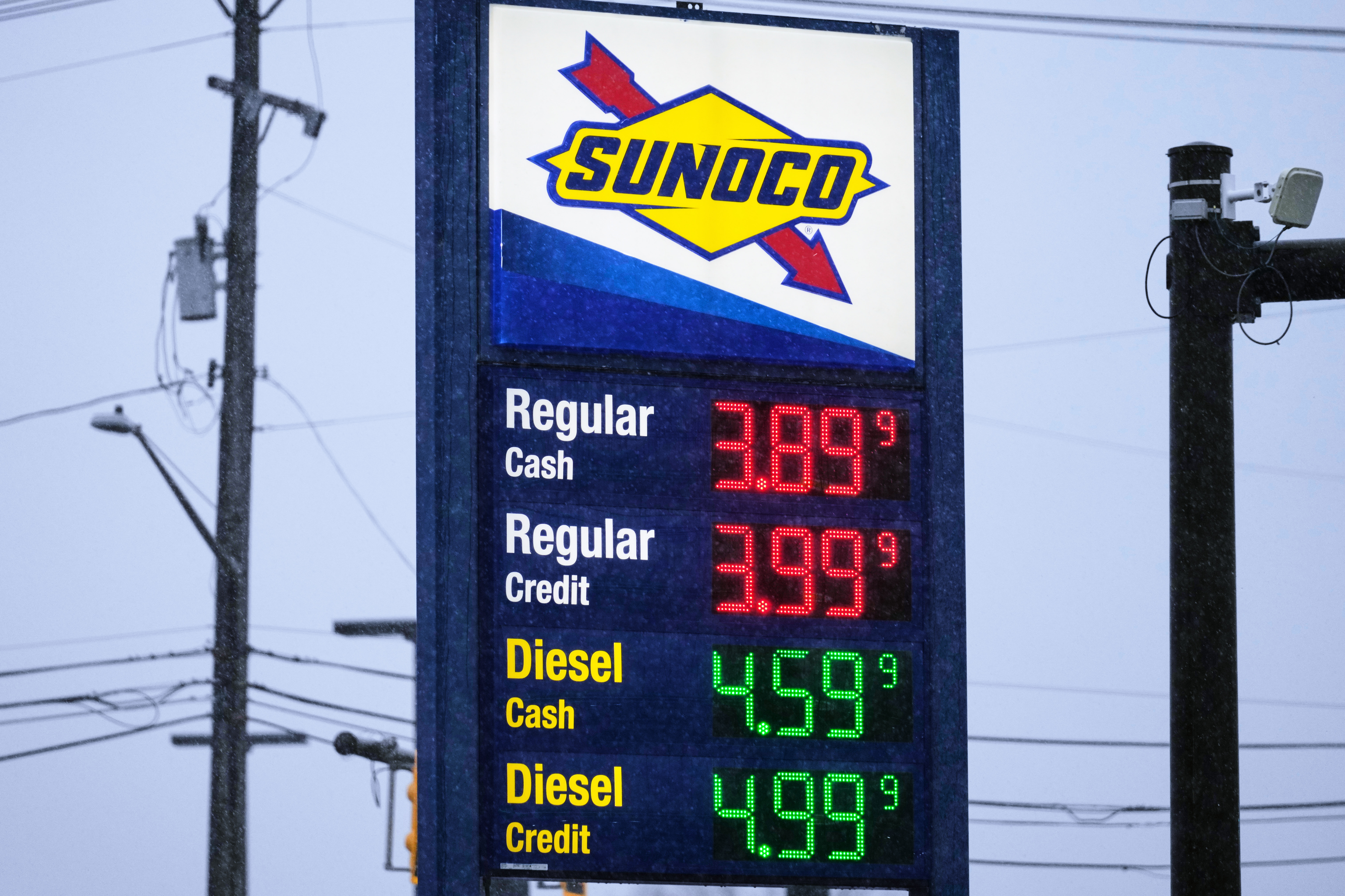 Sunoco gas station price sign displaying regular and diesel fuel prices in cash and credit options