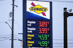 Sunoco gas station price sign displaying regular and diesel fuel prices in cash and credit options