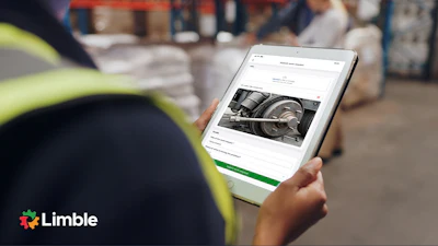 Worker in safety vest viewing maintenance documentation on tablet displaying equipment image