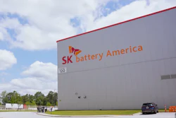 SK Battery America manufacturing facility with company logo and signage on white industrial building exterior