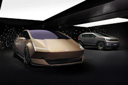 Hyundai concept electric vehicles displayed in modern showroom with ambient lighting