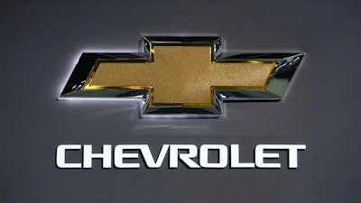Chevrolet gold bowtie logo with chrome trim and brand name text