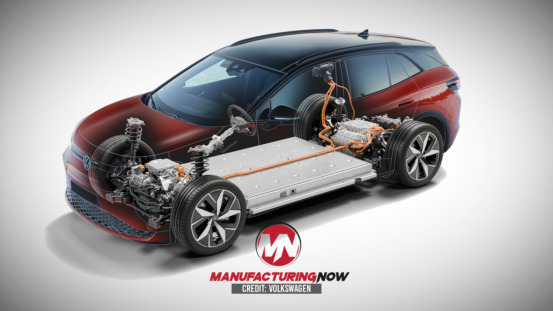 Volkswagen electric vehicle cutaway showing battery pack, motor, and drivetrain components with Manufacturing Now branding