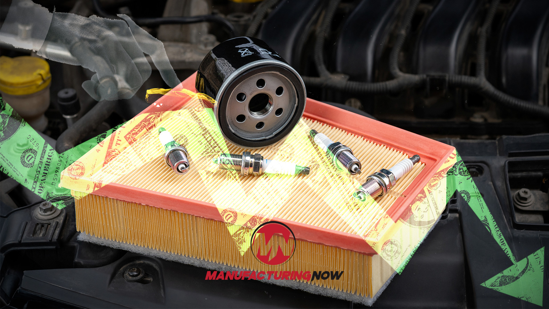 Automotive maintenance kit with oil filter, air filter, and spark plugs displayed on yellow packaging in engine bay