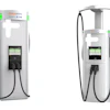 Two white ChargePoint electric vehicle charging stations with digital displays and black charging cables