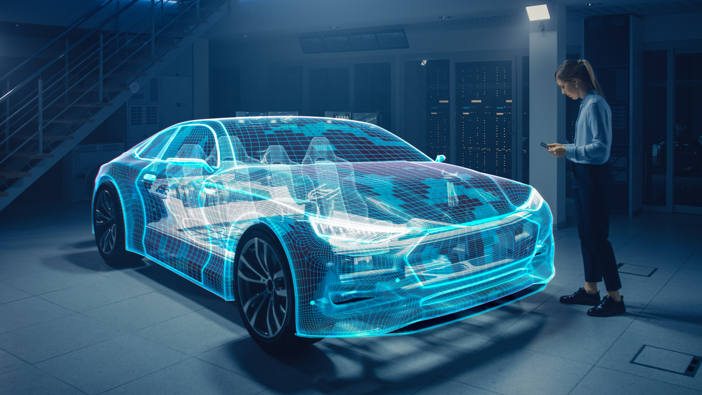 Engineer examining holographic 3D wireframe visualization of electric vehicle in modern tech facility