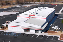 Aerial view of Ryder commercial warehouse facility with white roof and red signage in industrial area