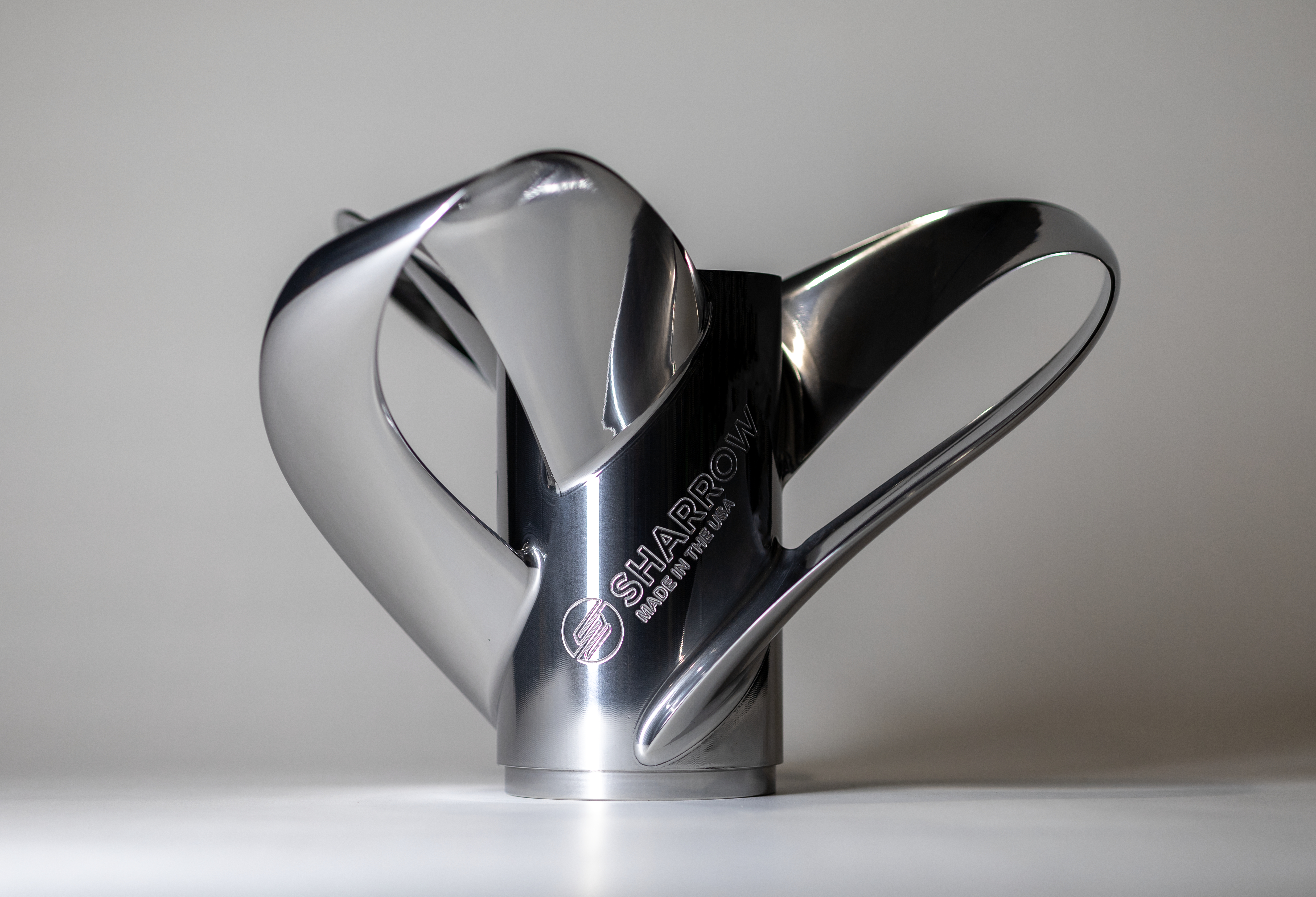 Sharrow brand chrome kitchen utensil with curved handles and metallic finish