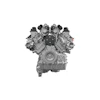 Front view of a symmetrical V-engine with dual overhead cams and four valve covers in grayscale technical illustration