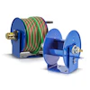 Blue industrial hose reels with coiled green and red hoses for fluid transfer applications